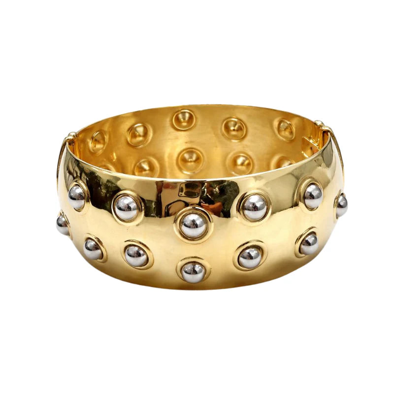 Pulsera metálica con lunares